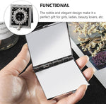 Black portable pocket makeup mirror showing high definition glass