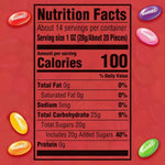 Assorted colorful fruit flavored Starburst jelly beans spilled out on a table highlighting strawberry and lemon flavors.