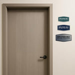 Brushed gold employees only door sign angled view