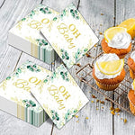 Elegant gender neutral baby shower table decorations featuring the folded five by five inch eucalyptus napkins.