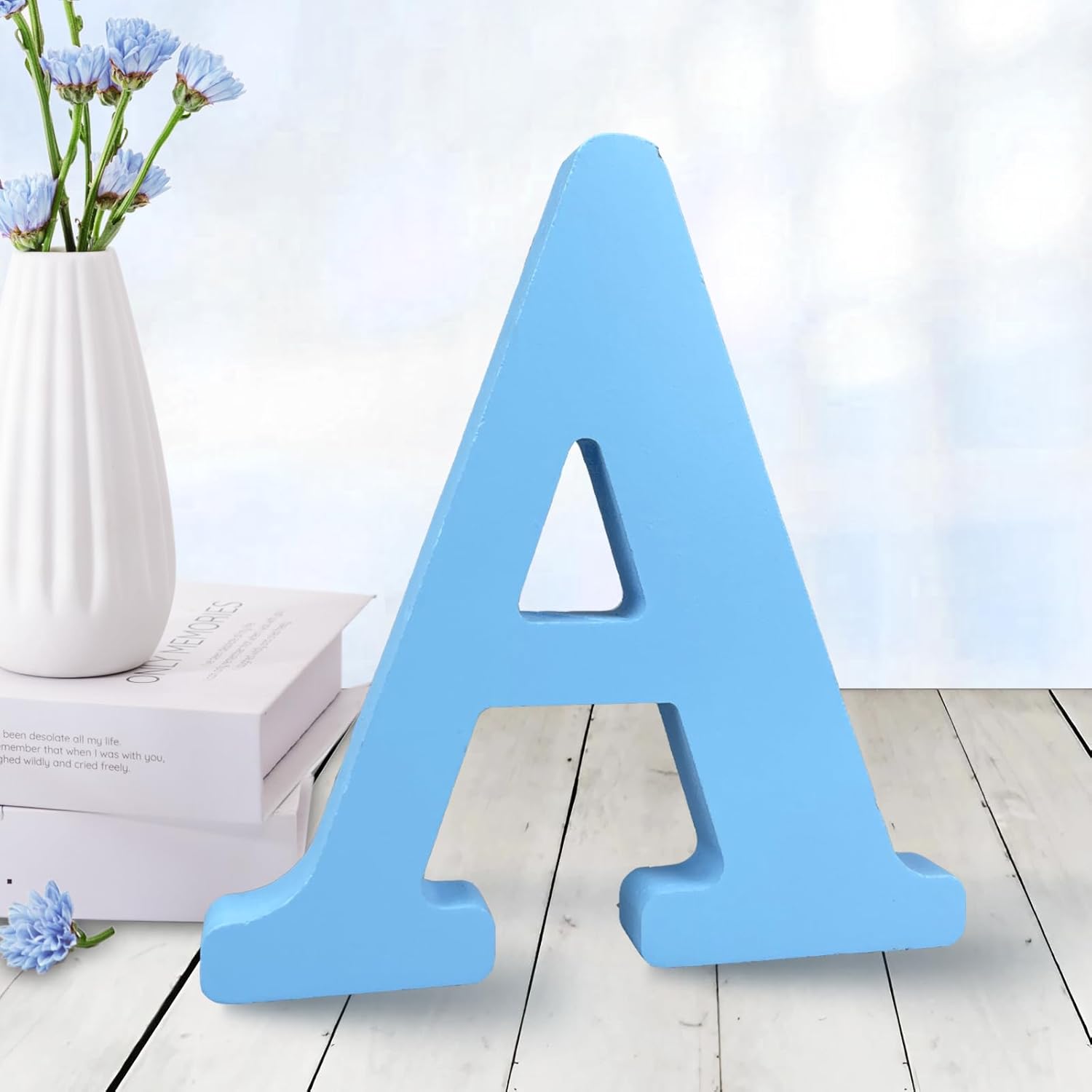 AOCEAN 6 inch blue wood letter A front view standing on a rustic wooden table.