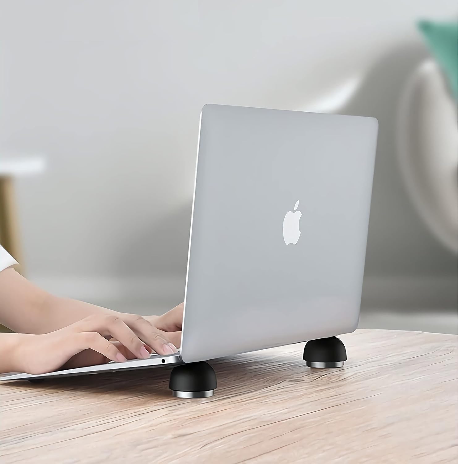 LVSU laptop cooling stand invisible cooler ball front view supporting a silver notebook on a modern workspace desk