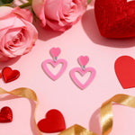 Choice of all pink acrylic earrings lifestyle view