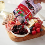 Close up of Sun-Maid dried mixed berry snack bag with cranberries, cherries, and blueberries.
