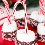 Individually wrapped red and white striped peppermint candy canes from Sarah's Candy Factory.