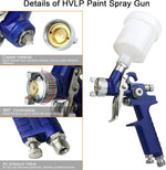Close-up view of the gravity-feed fluid cup attached to the pneumatic spray gun