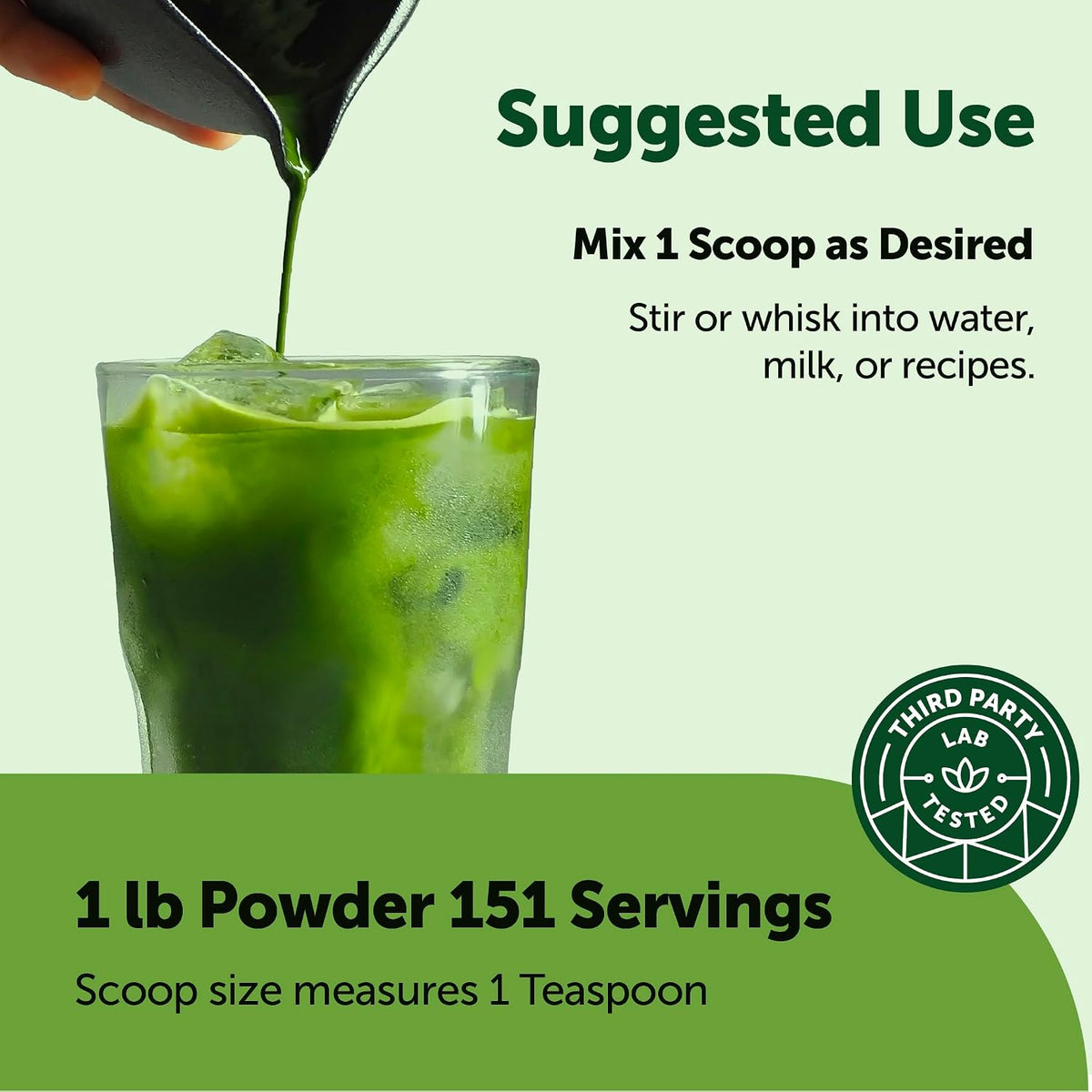 Prepared creamy green tea matcha latte in a glass cup