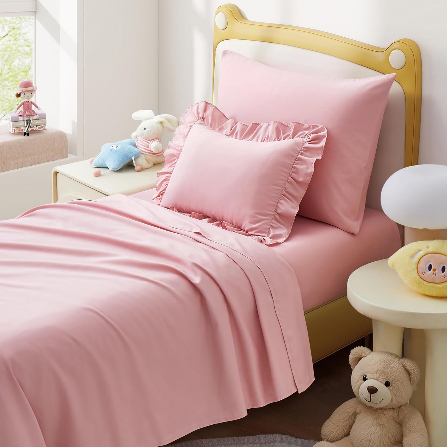 Uozzi Bedding 4 piece toddler sheet set front view in light pink