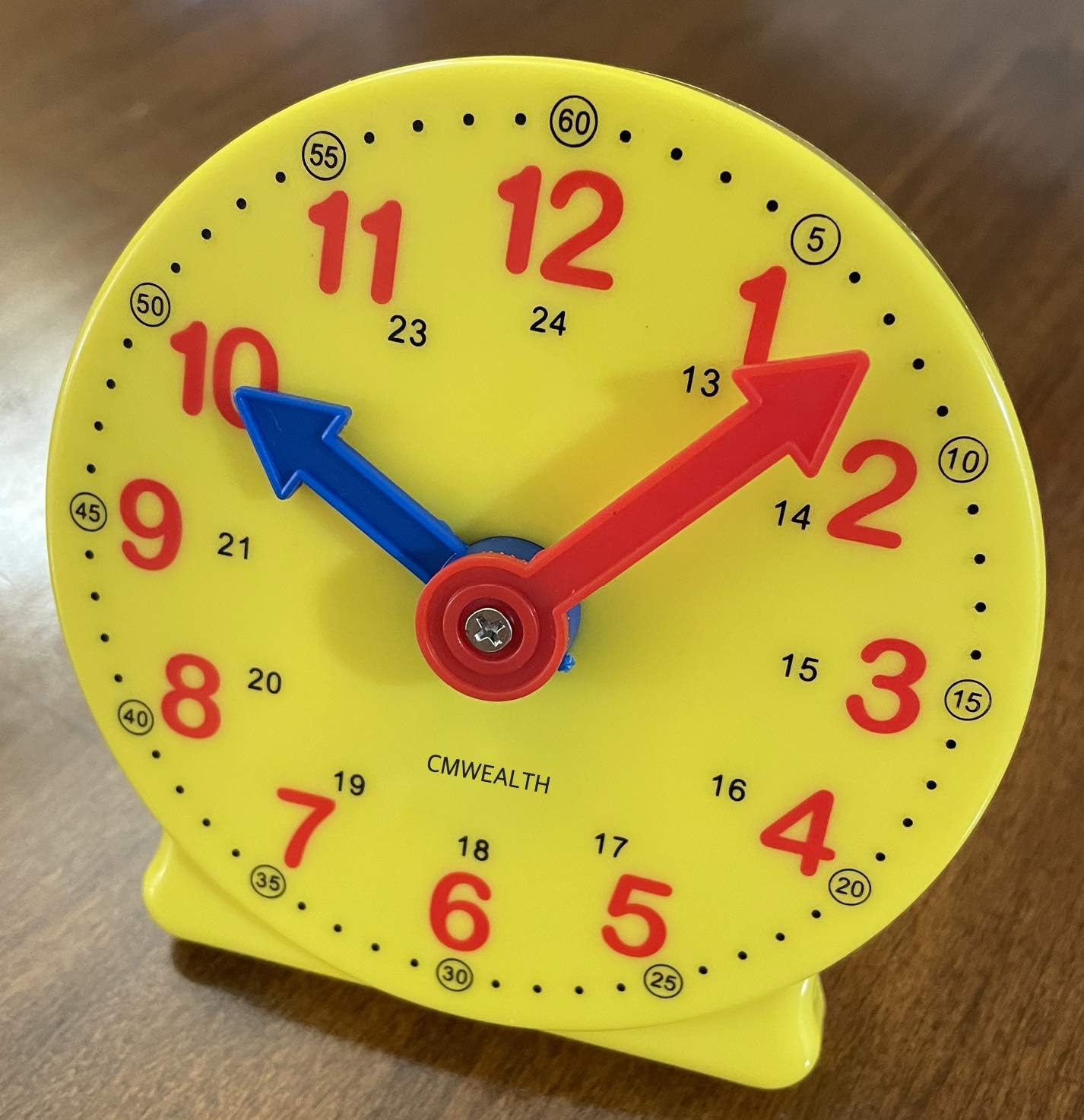 CM Wealth learning clock for kids front view showing yellow frame and blue gear hands