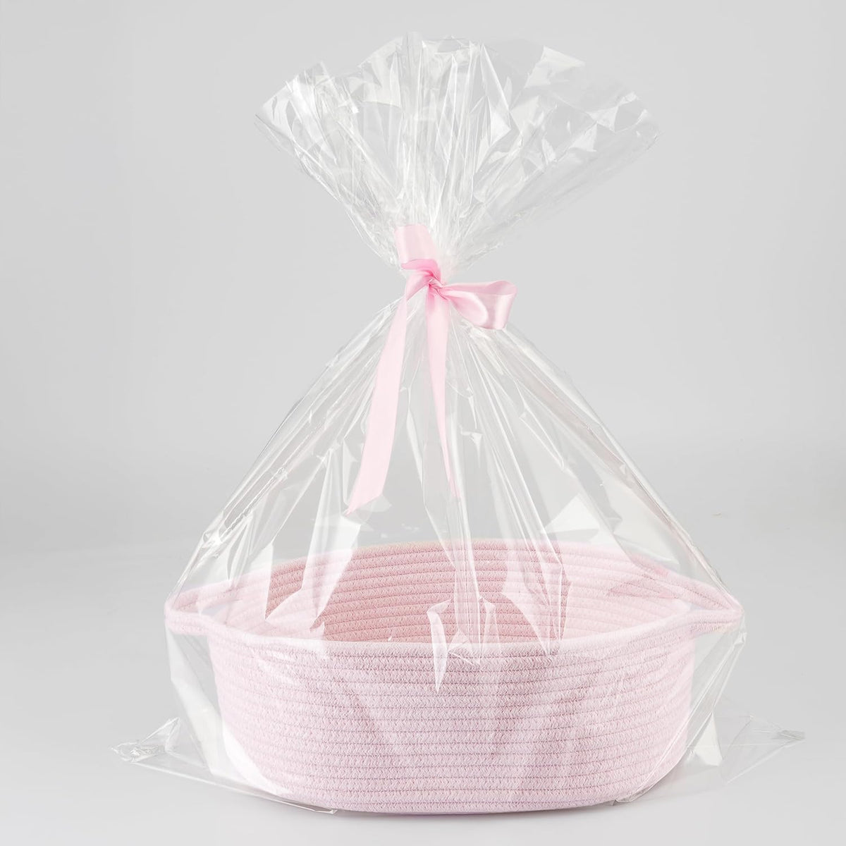 APOMOONS empty baby gift basket front view showing the pink woven cotton rope texture and handles.