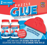 MasterPieces jigsaw puzzle glue two pack front view showing the unique puzzle piece shaped bottles and wide plastic spreader applicator.