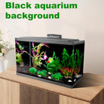 Aquascaped fish tank with a COCODE black backdrop hiding wires and highlighting colorful fish.