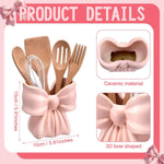 Hushee pastel pink kitchen utensil holder filled with wooden cooking spoons