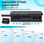 Close-up of the stretchable alignment ruler on the hole punch base