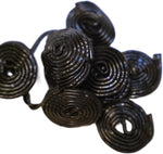 Top view of DM Sweets Black Licorice Wheels highlighting the distinct traditional spiral pattern.