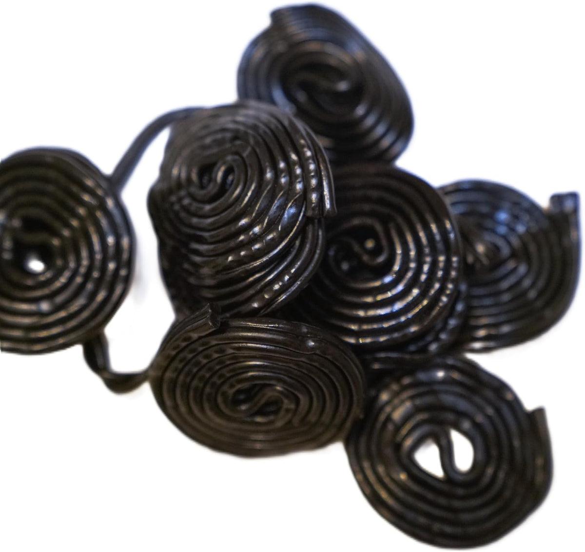 Top view of DM Sweets Black Licorice Wheels highlighting the distinct traditional spiral pattern.