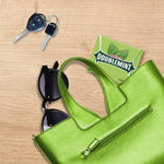 Person holding a pack of classic USA imported Doublemint chewing gum for fresh breath.