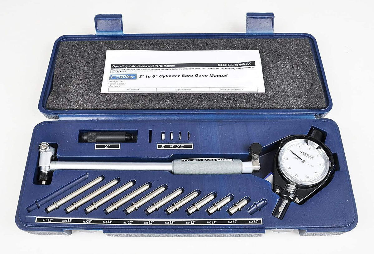 Complete 2 to 6 inch range bore gage kit laid out in case