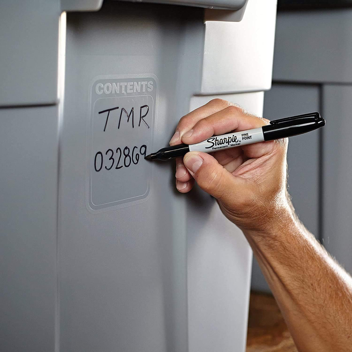 Sharpie black marker labeling plastic and metal items