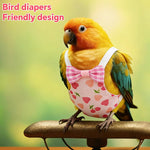 Adjustable elastic straps and hook-and-loop closure detail on a pink bird nappy.