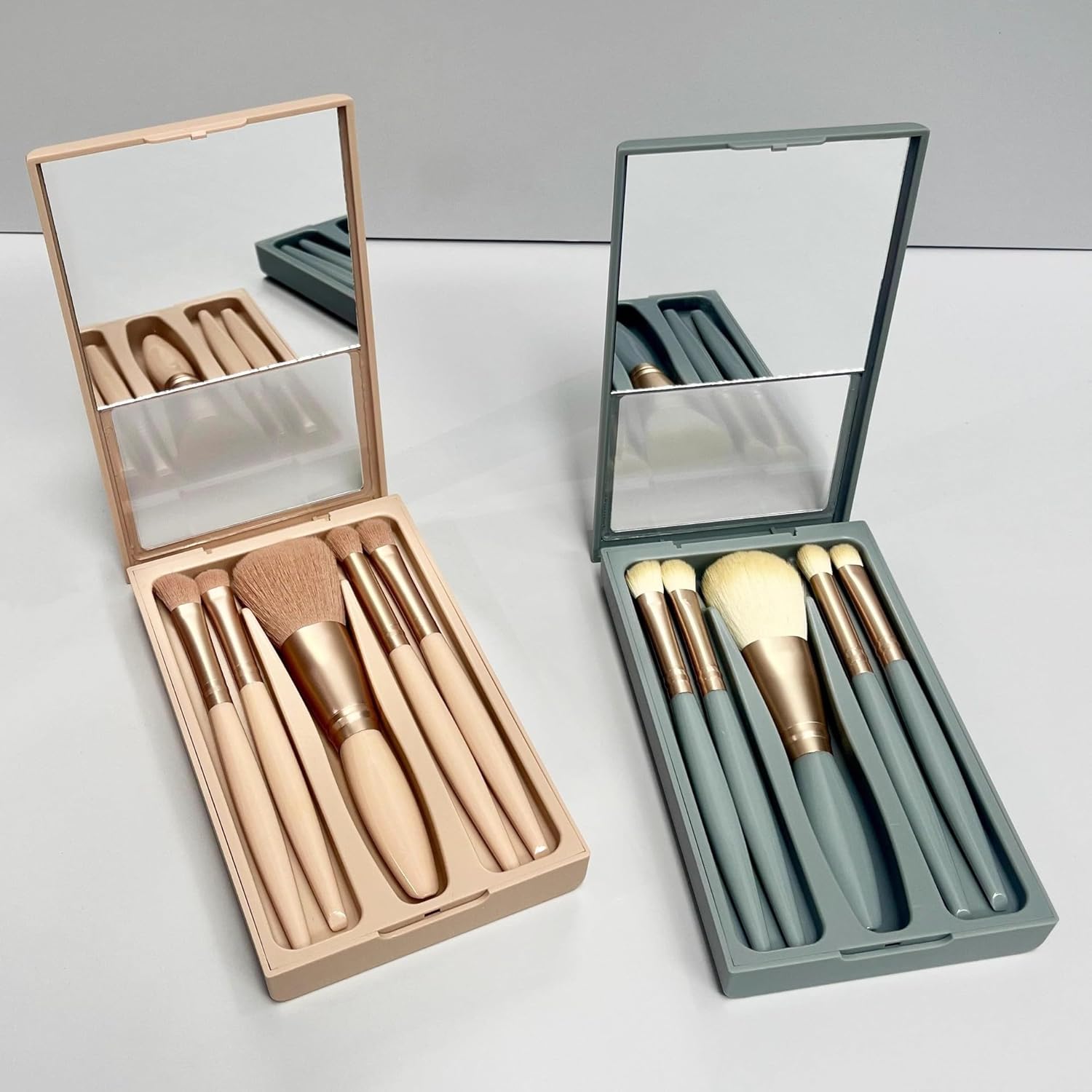 Generic professional makeup brush set with mirror front view of the open pink travel case showing five soft synthetic brushes inside.