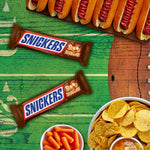 Snickers full size individually wrapped chocolate bars stacked together