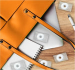 Individually wrapped orange mint hard candies in the iconic ring shape.