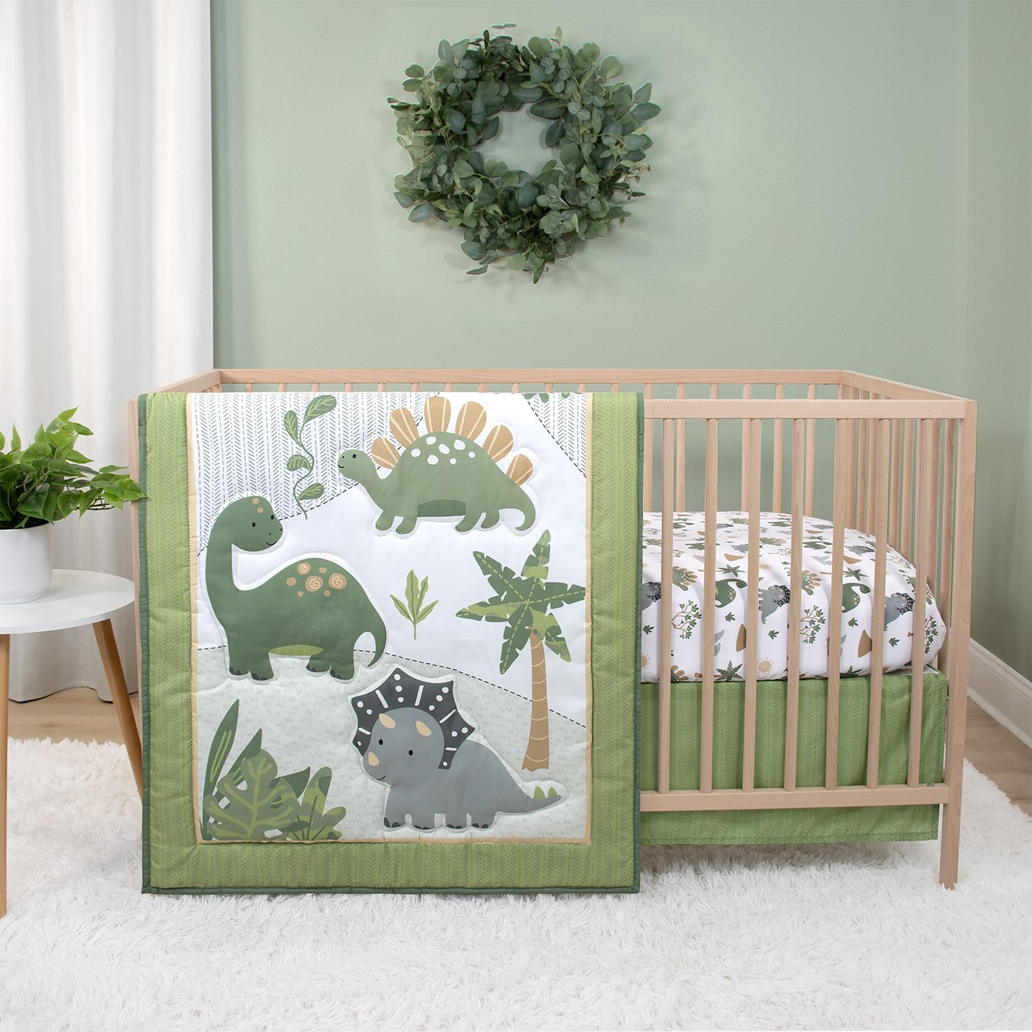 The Peanutshell Dinosaur Dreams 3 Piece Baby Crib Bedding Set front view in nursery