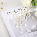 Gadjica heart and bowknot shape white pearl charms close up crafting supply