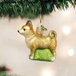 Rear view of the Chihuahua holiday decoration featuring the curled tail and golden tones.