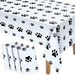Two pieces of pink paw print tablecloths stacked together