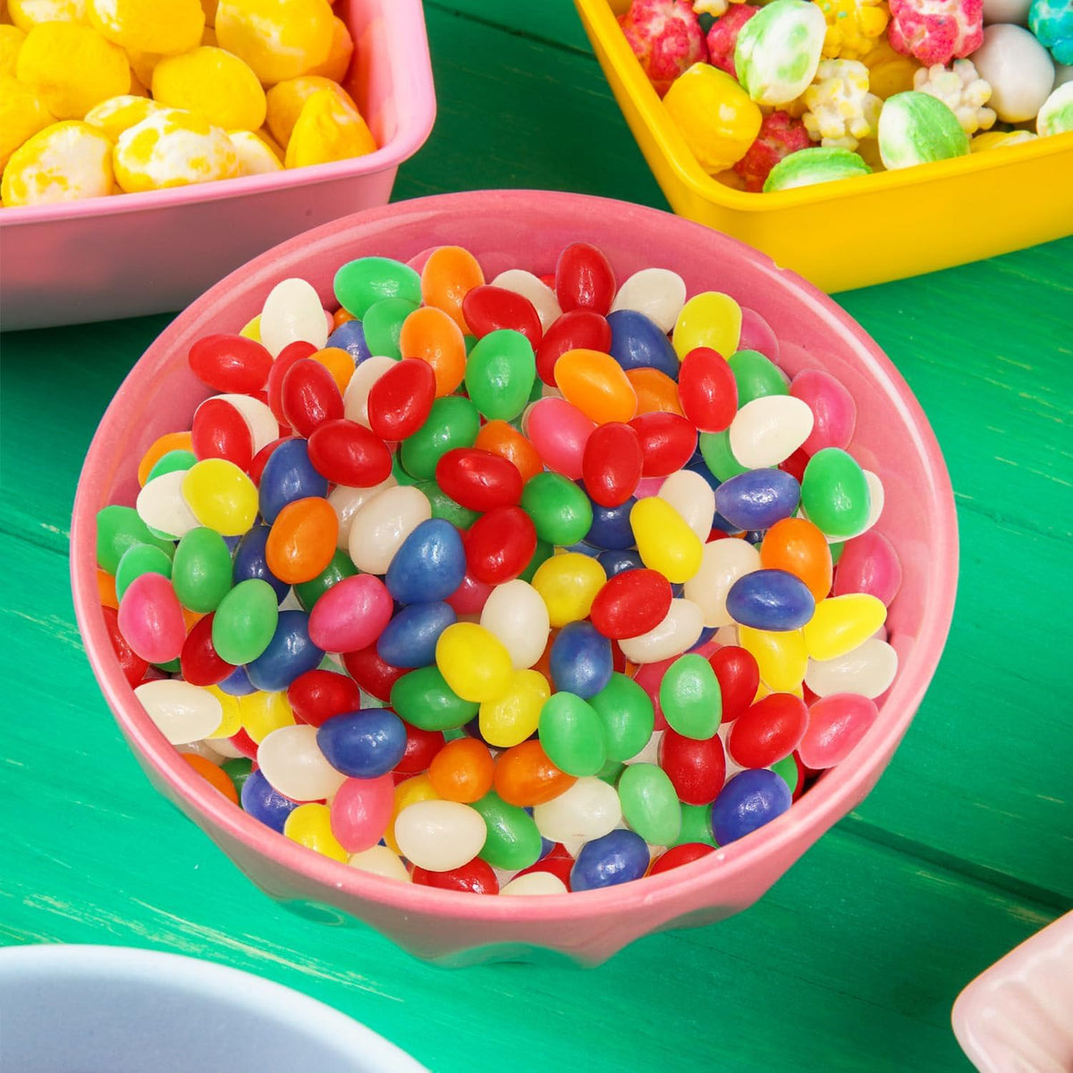Colorful jelly bean assortment arranged neatly inside a glass candy jar