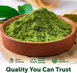 Healthy fruit and vegetable smoothie blended with green matcha powder