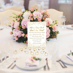 Instruction sign and ring favors arranged for engagement party setup