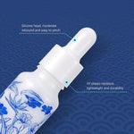 Blue and white floral botanical pattern detail on the ceramic bottle body