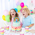 Paw print party supplies styled with birthday decorations