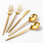 Rubtlamp ninety pieces gold plastic silverware set front view for party table arrangements