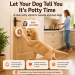 Wireless puppy potty training bell button being pressed by a dog paw