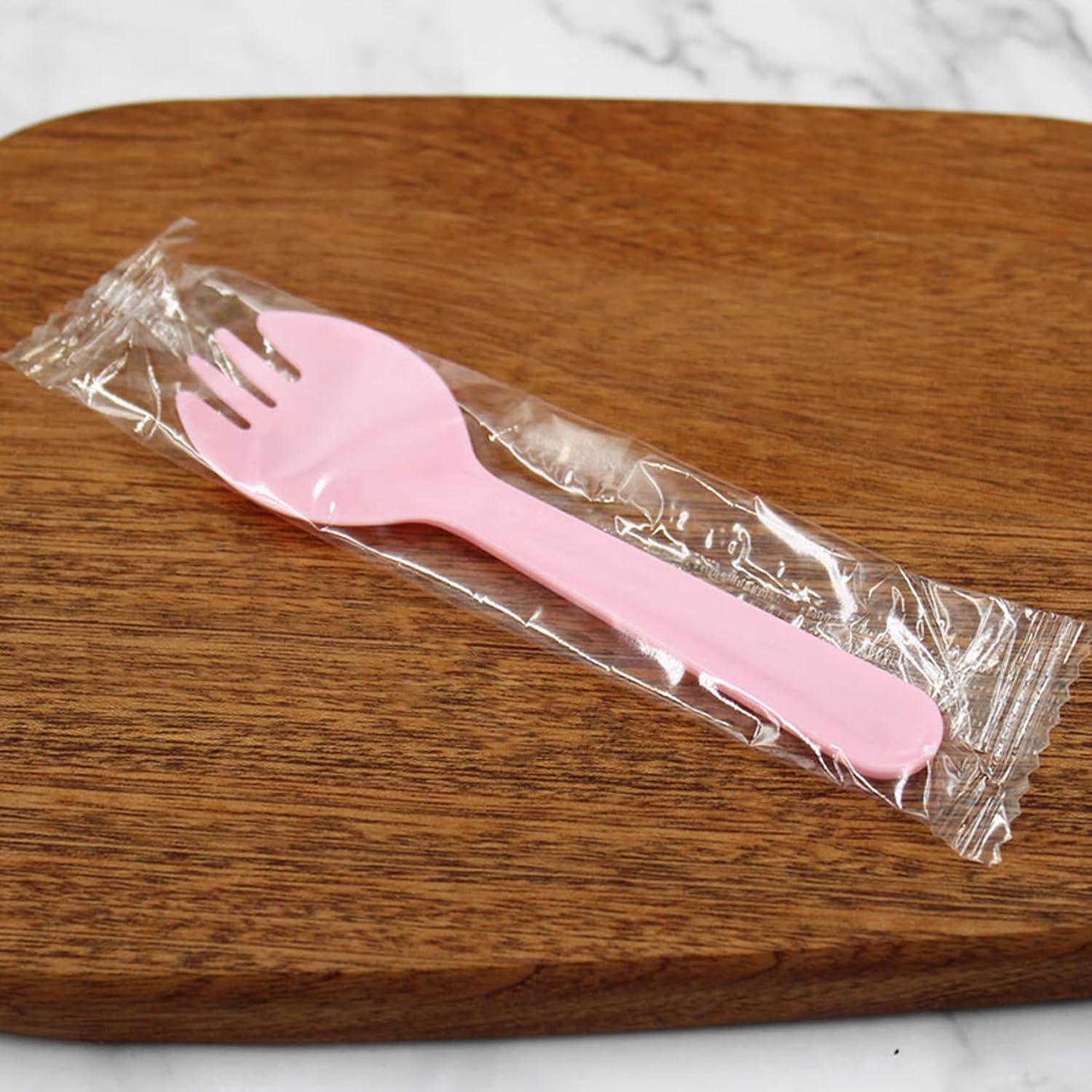 JIEOU disposable plastic sporks front view of pink dessert cutlery