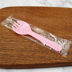 JIEOU disposable plastic sporks front view of pink dessert cutlery