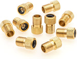 Brass bicycle valve converter attached to tire stem