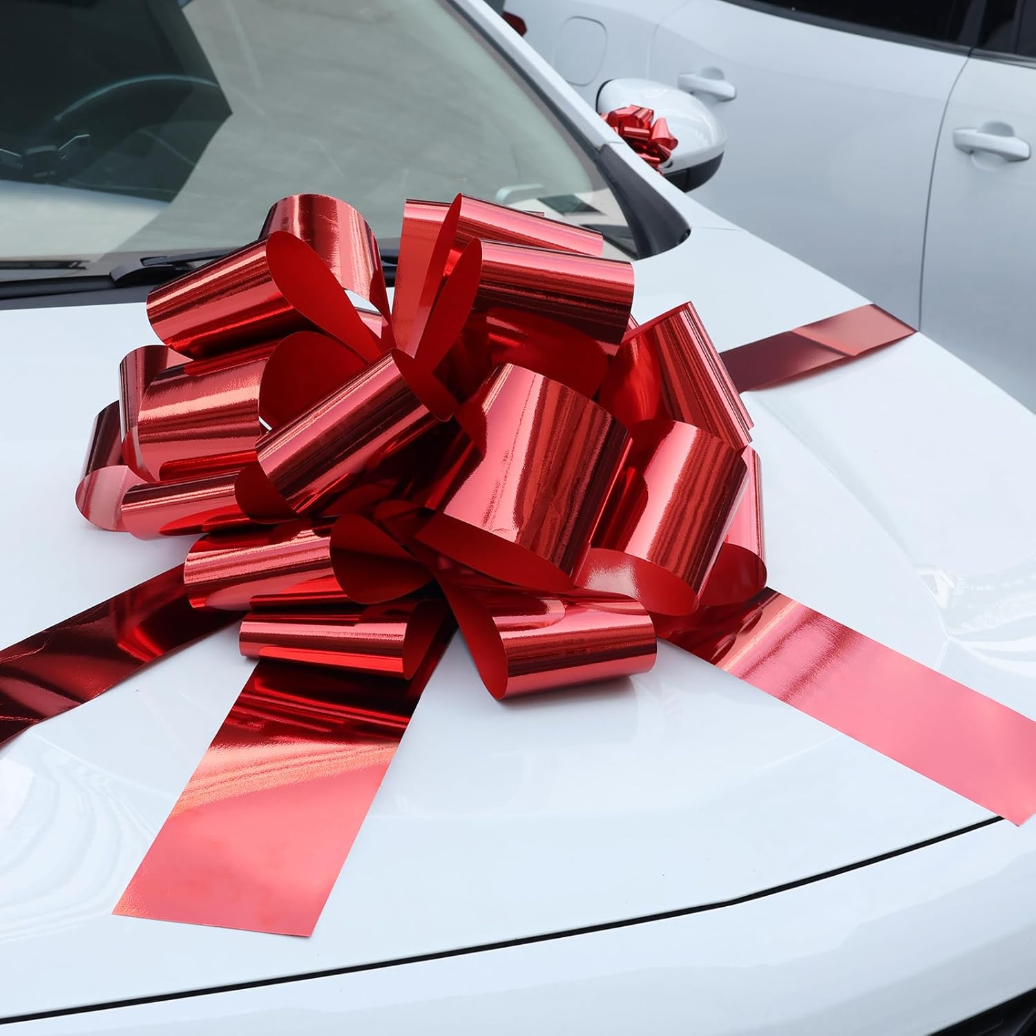 Hollima Big Car Bow Metallic Red twenty inch round shape front view on a white vehicle hood.