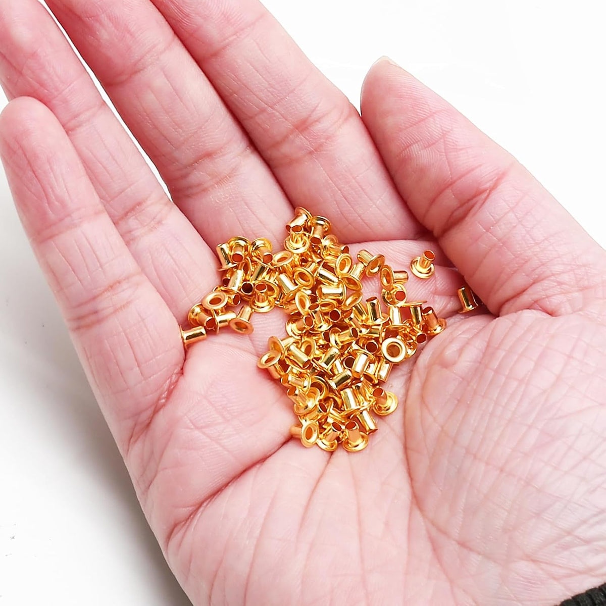 Litoexpe 200 pieces tiny metal eyelets shown with installation punch tool