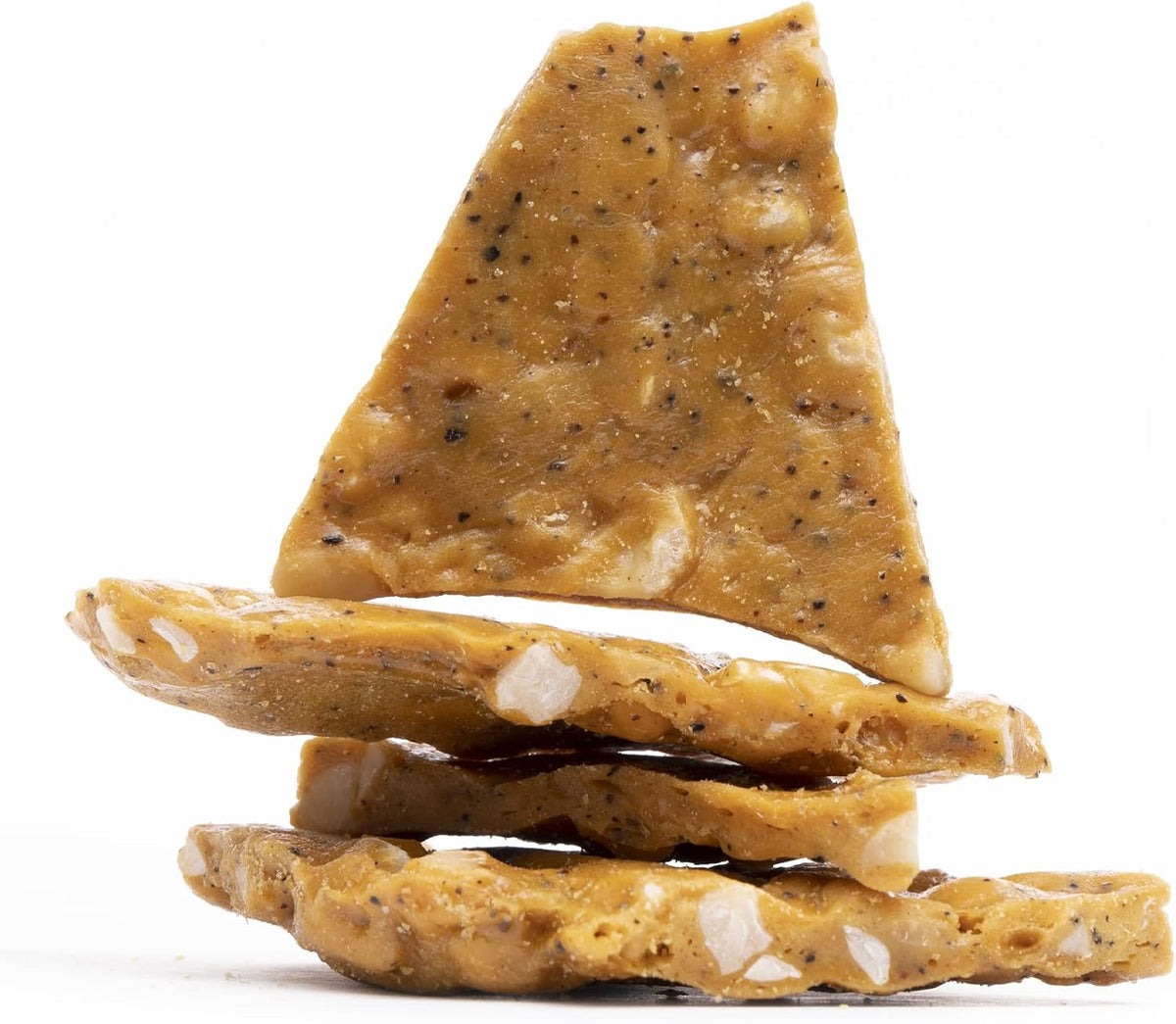 Close up of all natural Hawaiian macadamia nut candy pieces showcasing crunchy texture