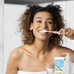 Desert Essence coconut oil toothpaste lifestyle bathroom setting