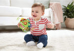 VTech musical tambourine showing light-up flower button and handle