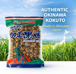 Authentic Okinawan black sugar chunks displayed outside the packaging highlighting the irregular rock shapes.