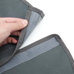 Outdoor garden umbrella base cover showing fastener strip