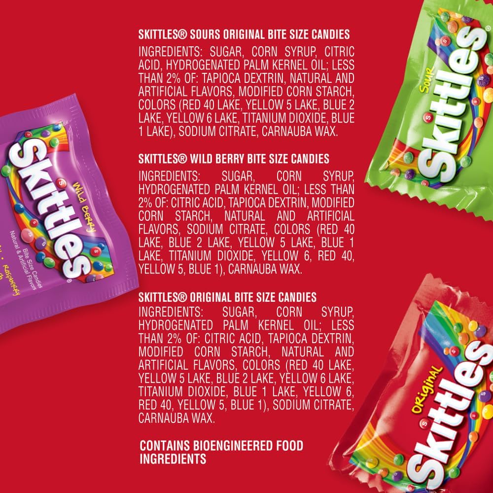 Individually wrapped fun size fruity candy pouches scattered out of the large party size bag