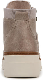 Close up of the textured fabric and lace up details on women's wedge sneakers